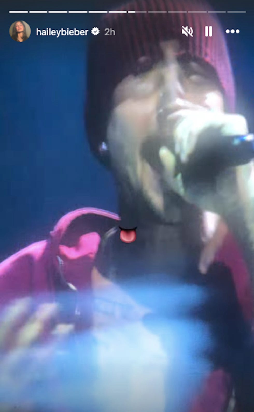 Social media post featuring a person wearing a pink hoodie.