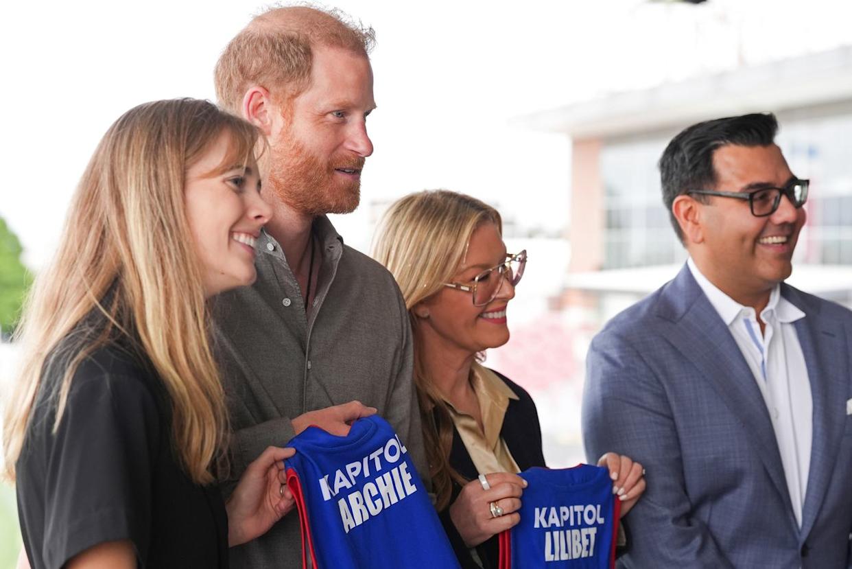 Prince Harry is presented with Western Bulldogs Archie and Lilibet jerseys during a visit to Movember at the Western Bulldogs HQ at Mission Whitten Oval on April 15, 2026 in Melbourne, Australia.Credit: Jonathan Brady-Pool/Getty