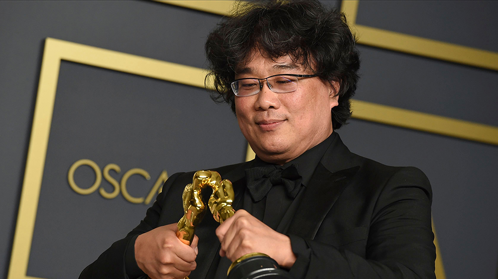 Bong Joon Ho poses in the press room with the awards for best director for "Parasite" and for best international feature film for "Parasite" from South Korea at the Oscars, at the Dolby Theatre in Los Angeles92nd Academy Awards - Press Room, Los Angeles, USA - 09 Feb 2020