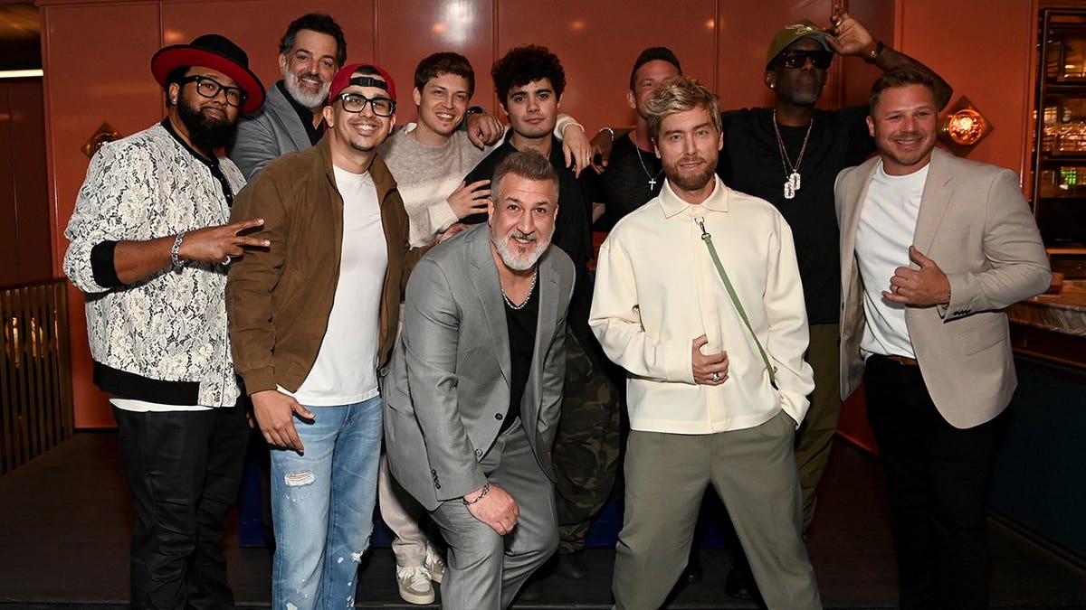 Jamie Jones, Joe Mulvihill, Erik-Michael Estrada, Ricky Garcia, Joey Fatone, Emery Kelly, Jeff Timmons, Lance Bass, Shawn Stockman, and Steve Mooney posing at The Sun Rose in West Hollywood