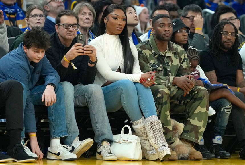 Megan sits courtside during the Dallas Mavericks and Golden State Warriors game on Christmas Day in San Francisco, California. Thompson only had 7 points that night.