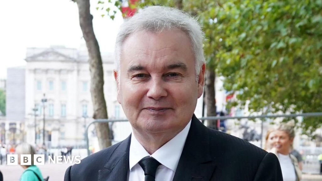 A file photo from 2022 shows Eamonn Holmes, wearing a black suit, near The Mall in London