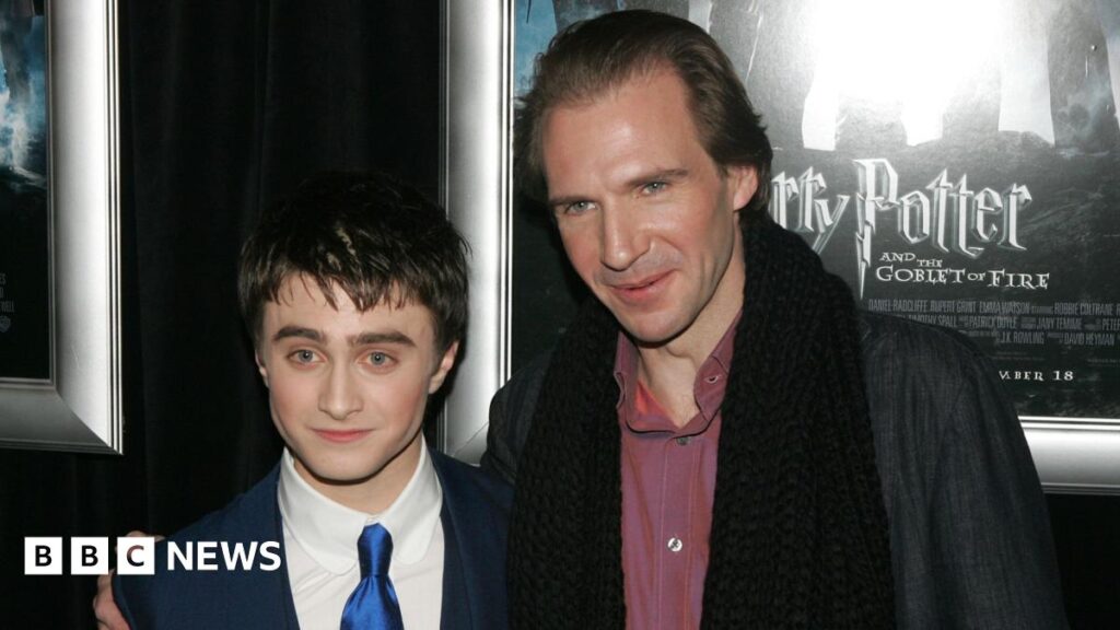 Actors Daniel Radcliffe and Ralph Fiennes pose for a picture at a premiere of Harry Potter and the Goblet of Fire.
