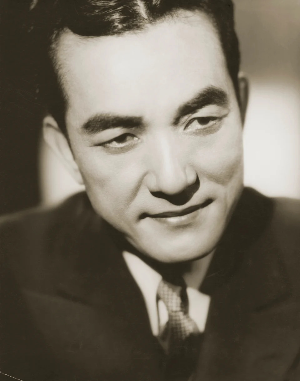 Sessue Hayakawa in a suit with a thoughtful expression