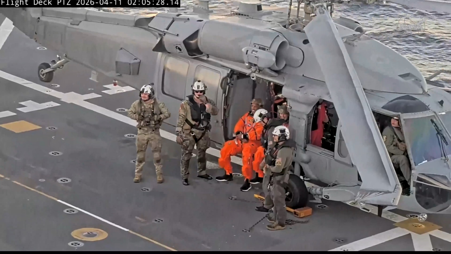 Big smiles from Artemis II astronauts, Christina and Victor on the deck of the USS John P. Murtha, as they waited to be escorted for their routine post-mission medical checks.