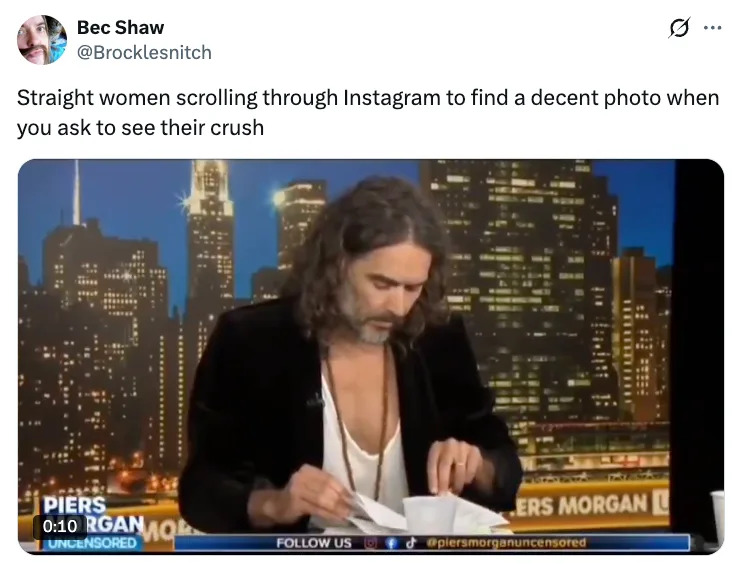 Man with long hair and casual suit appears on a TV show set. Tweet text humorously discusses straight women finding a decent photo of their crush