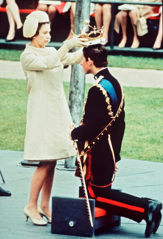 CAERNARVON;WALES - JULY 01: The Investiture of The Prince of Wales at Caernarvon Castle on July 1, 1969. Prince Charles kneels before the HRH Queen Elizabeth II as she places the coronet on his head. (Photo by Anwar Hussein/Getty Images)Anwar Hussein/Getty Images