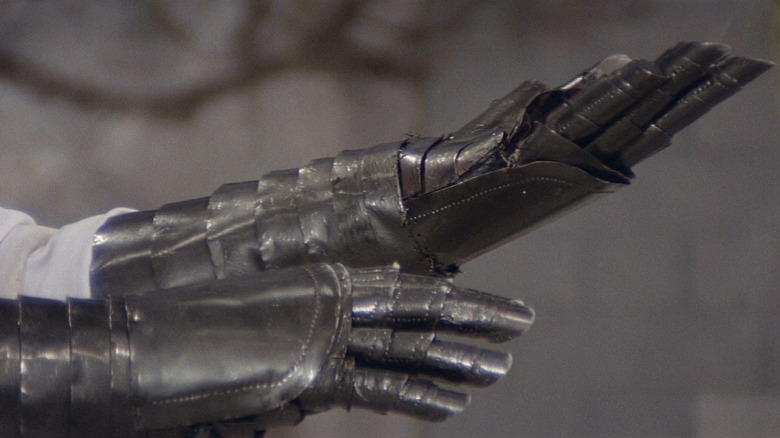 Lu Feng as Chang, showing off his metal arms in Crippled Avengers