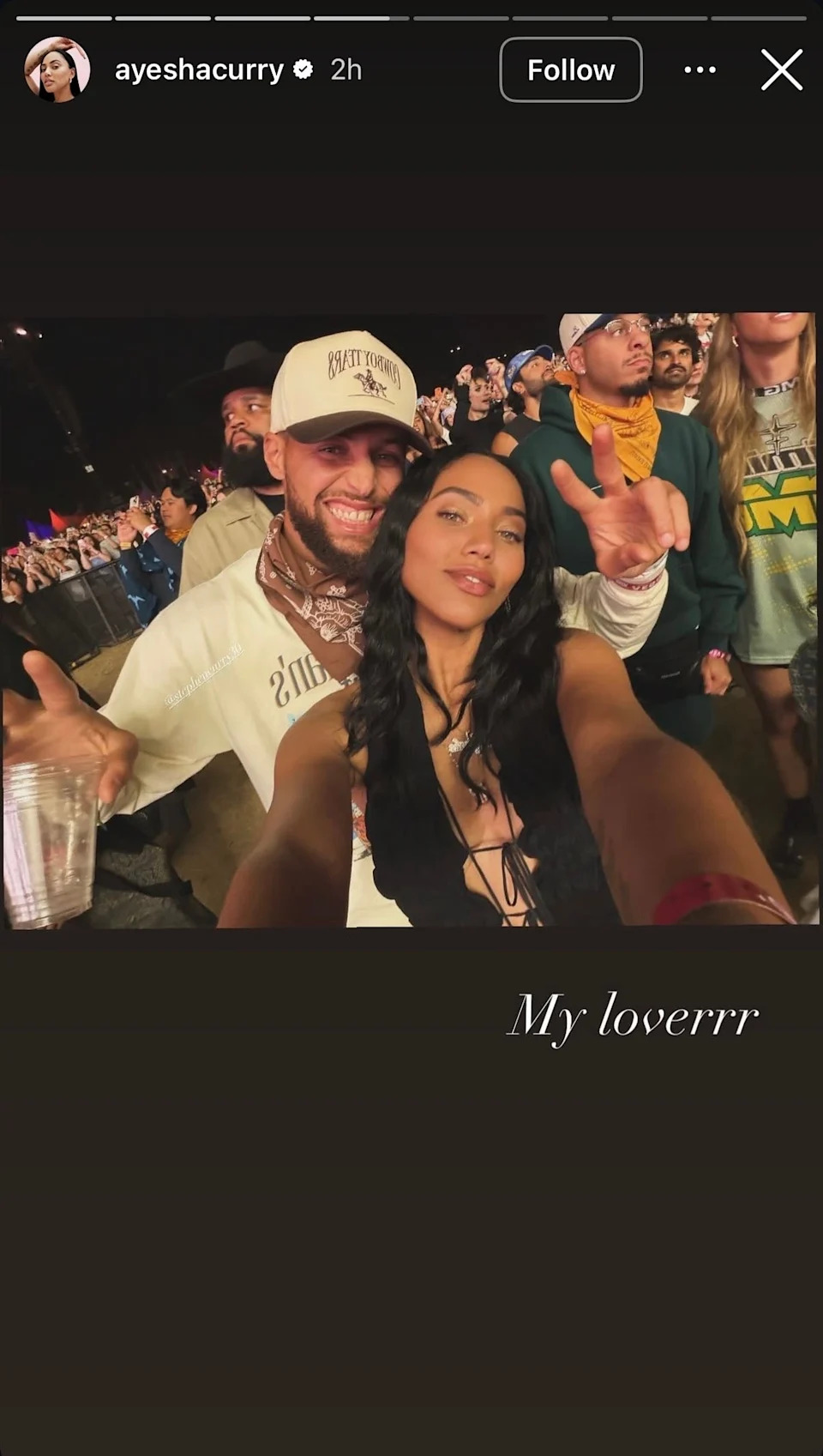 Steph Curry wears a hat and long sleeve shirt with a bandana tied around his neck and Ayesha Curry wears a sleeveless top at Coachella