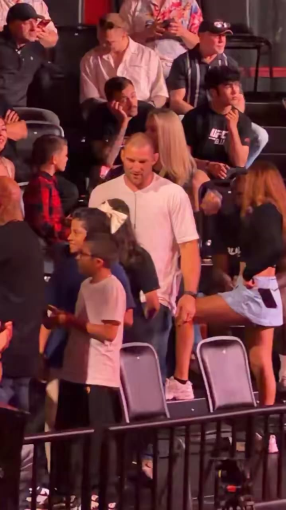 UFC fighter Sean Strickland tried to get a young girl to put up the middle finger during a photo, but she refused and did a peace sign instead