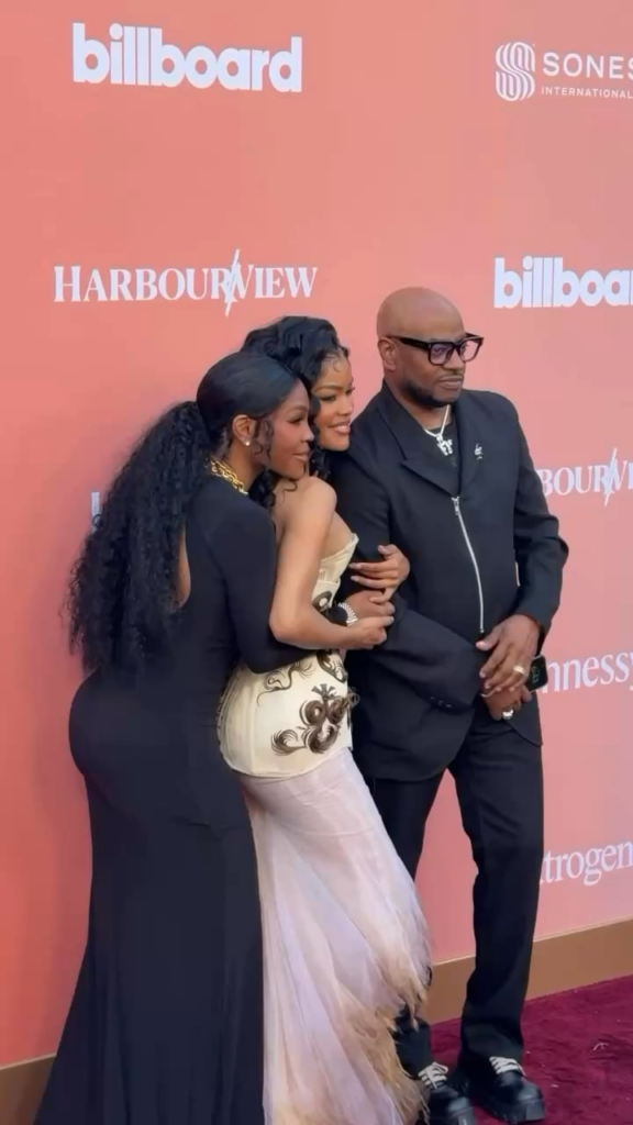 Teyana Taylor poses with her parents at Billboard’s Women in Music event (April 29, 2026)