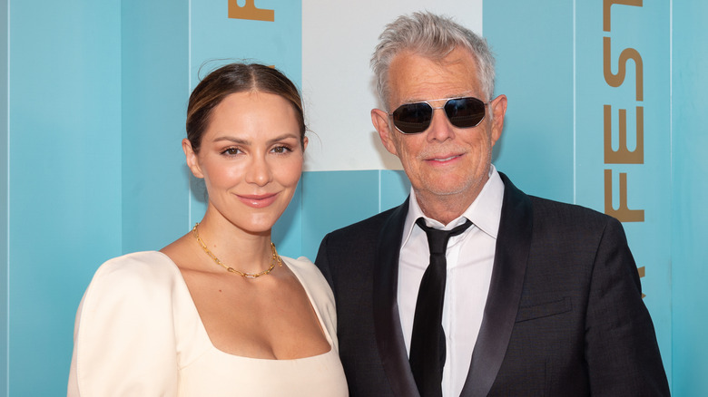 David Foster and Katharine McPhee smiling on red carpet