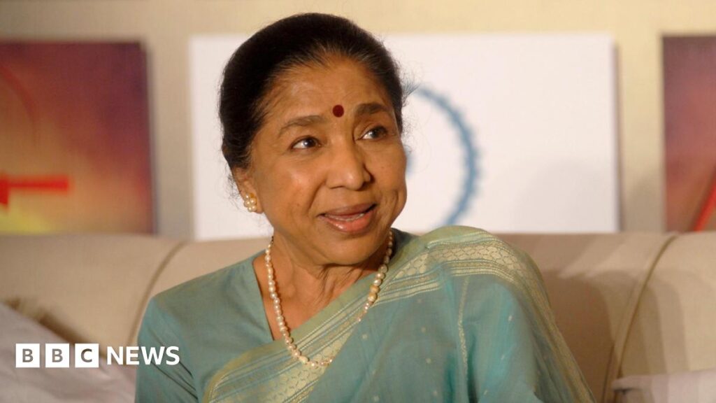 Asha Bhosle wearing a blue saree attends an event for the film 'Maaee' in Mumbai on April 27, 2011 in Mumbai, India
