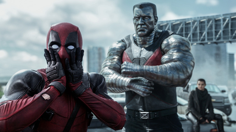Deadpool holds his face in front of Colossus and Negasonic Teenage Warhead in Deadpool.
