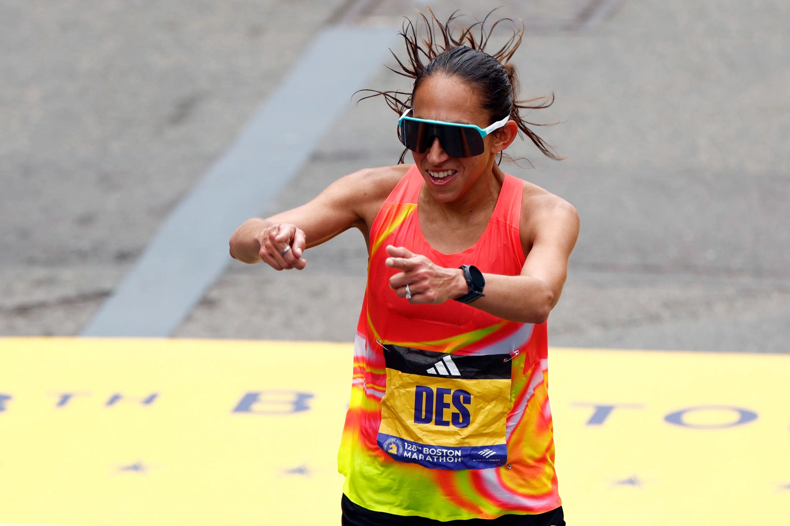 marathon24- Boston, MA - 4/15/24- American Des Linden crosses the finish line with a time of 2:28:27 in the Boston Marathon on Monday, April 15, 2024.