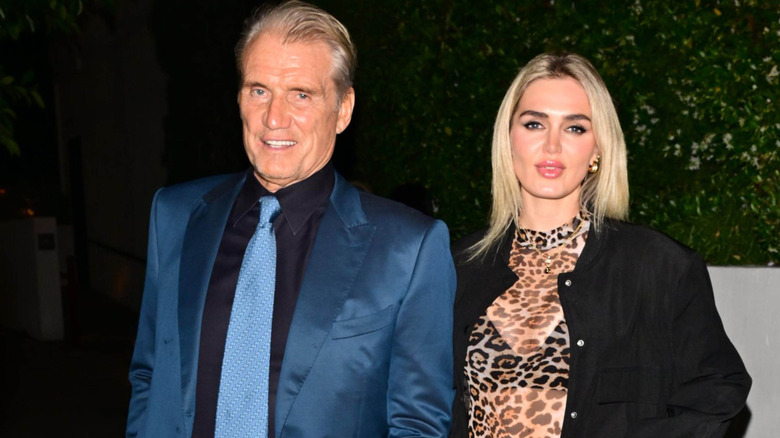 Dolph Lundgren and Emma Krokdal looking at camera