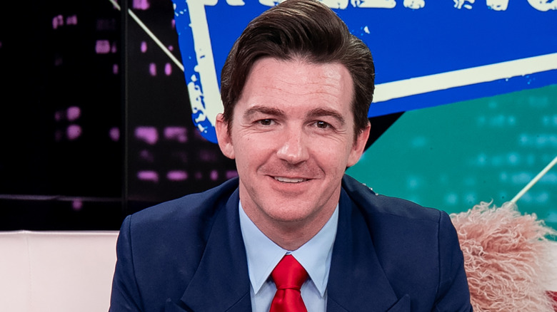 Actor and singer Drake Bell seated facing forward