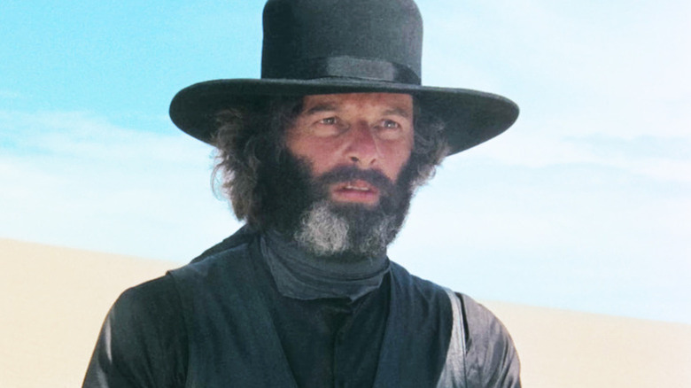 El Topo (Alejandro Jodorowsky) standing in the desert in 