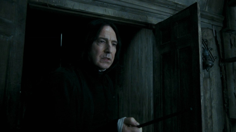 Snape (Alan Rickman) holding his wand in Harry Potter and the Prisoner of Azkaban