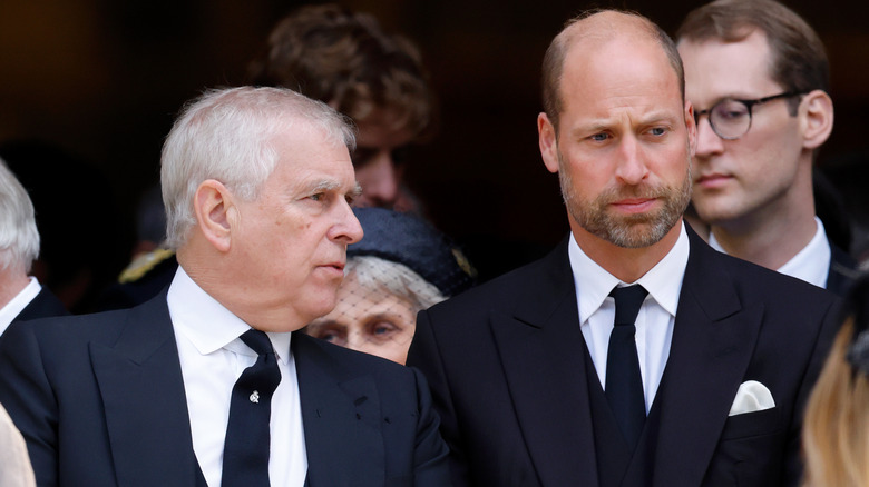 Andrew Mountbatten-Windsor attempting to speak to Prince William