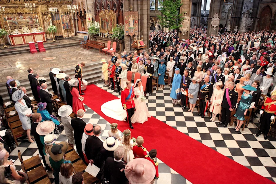 Dominic Lipinski/POOL WPA/AFP via Getty Images - PHOTO: Prince William and his wife Kate, Duchess of Cambridge, walk down the aisle of Westminster Abbey after their royal wedding in central London on April 29, 2011.