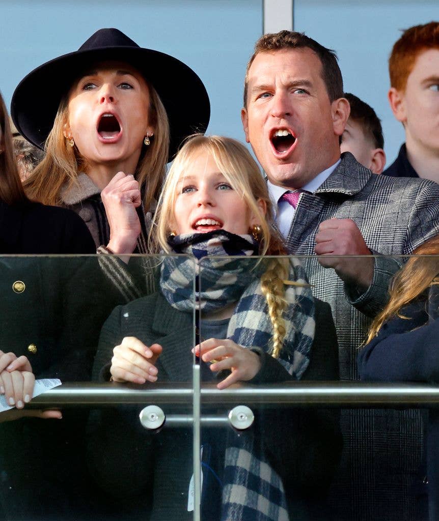 Harriet Sperling, Isla Phillips and Peter Phillips watch the racing as they attend the New Year's Day Racing Meet at Cheltenham Racecourse on 1 January 2026