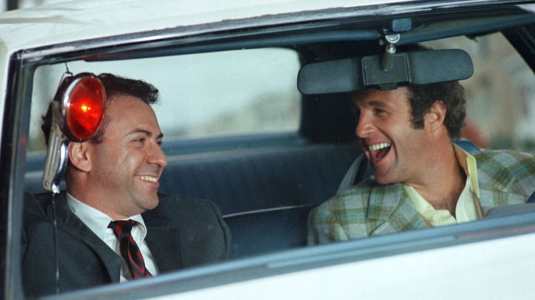 Alan Arkin as Bean and James Caan as Freebie, enjoying a laugh while on the job in Freebie and the Bean