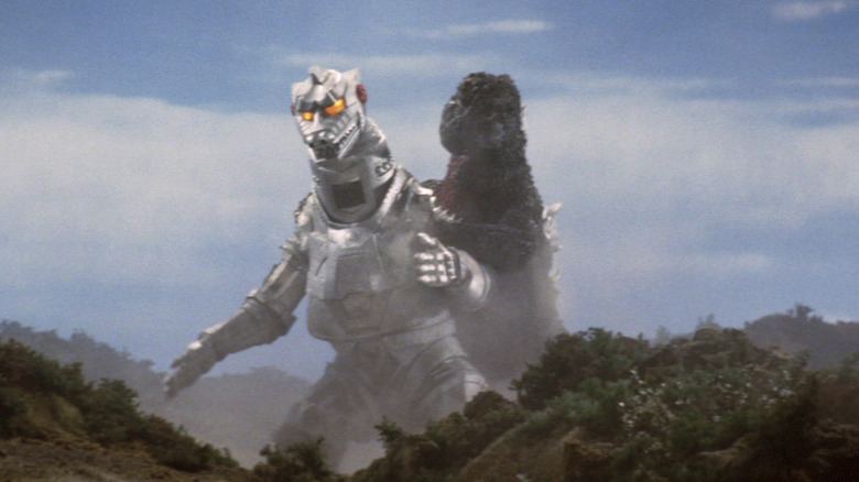 Mechagodzilla and Godzilla struggle in the hills in Godzilla vs. Mechagodzilla