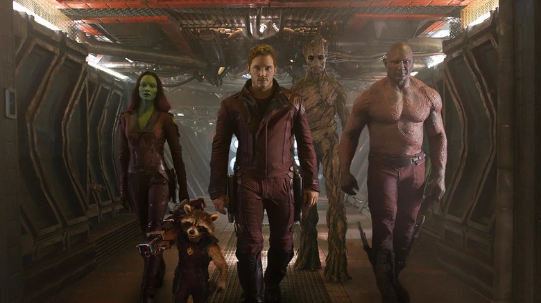 The Guardians of the Galaxy walk down a spaceship hallway in the 2014 film.