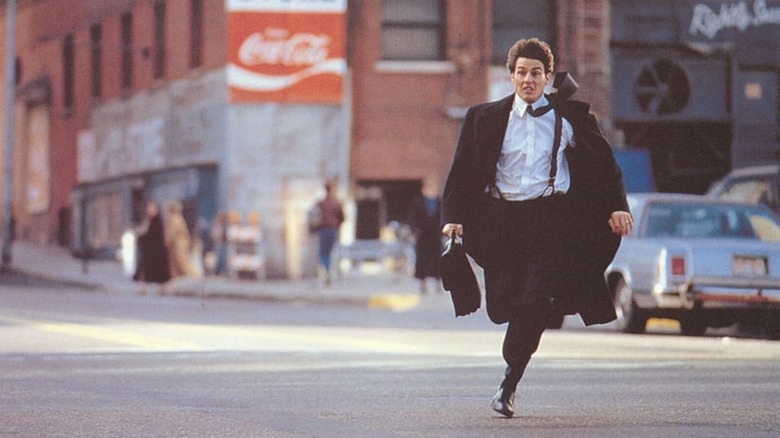 Tom Cruise as Mitch running with his briefcase in The Firm