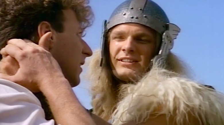 Thor grabbing Donald Blake by the neck and saying bye