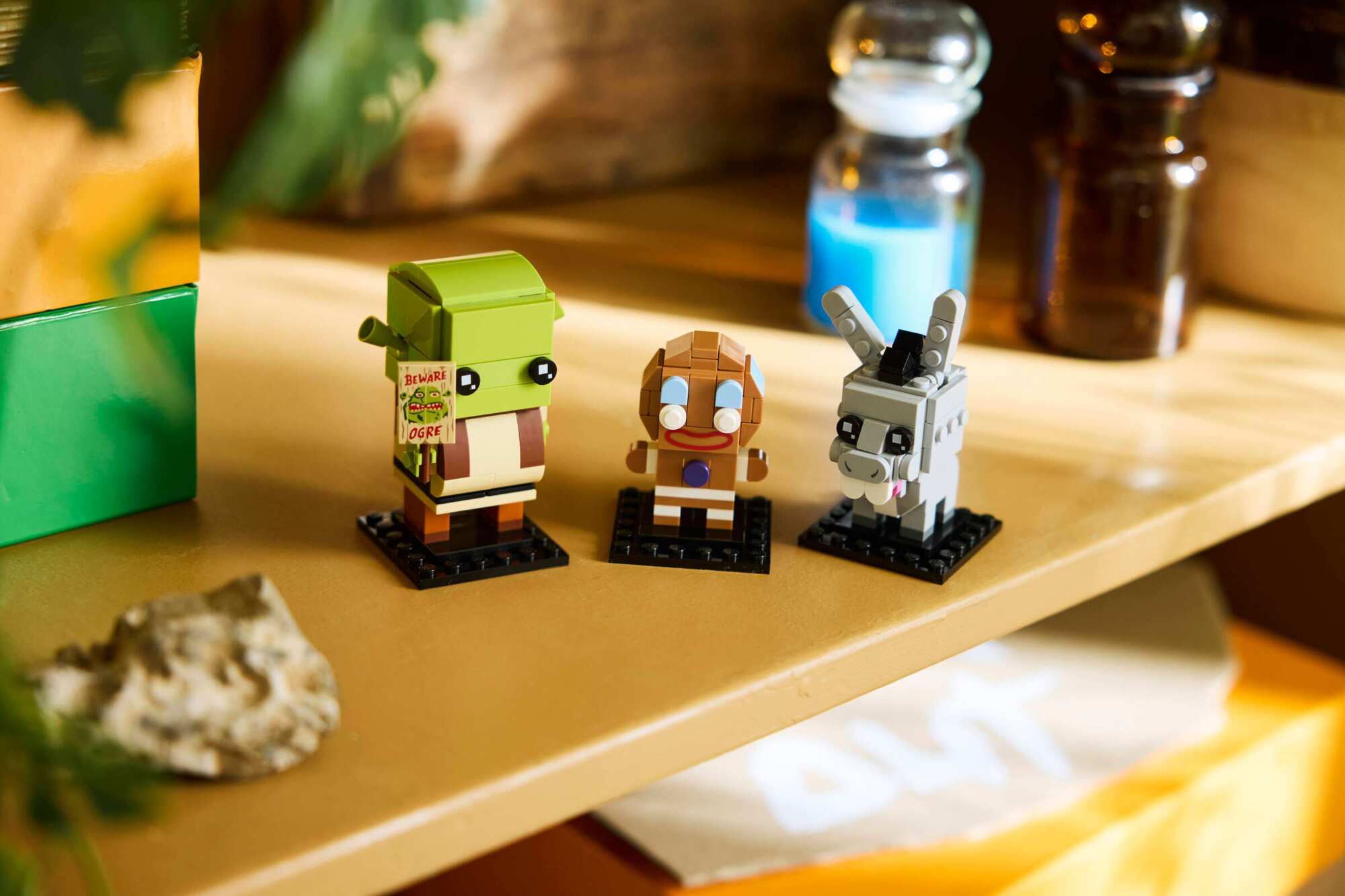 Lego BrickHeadz Shrek, Donkey & Gingy Figures standing in a line on a tabletop