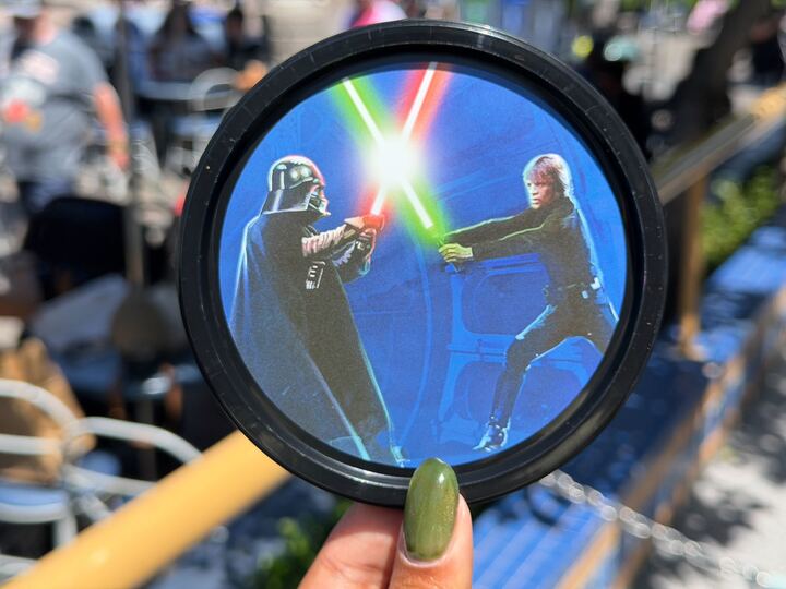 The Galactic Star Wars Souvenir Bucket features a circular print of the legendary Skywalker saber battle