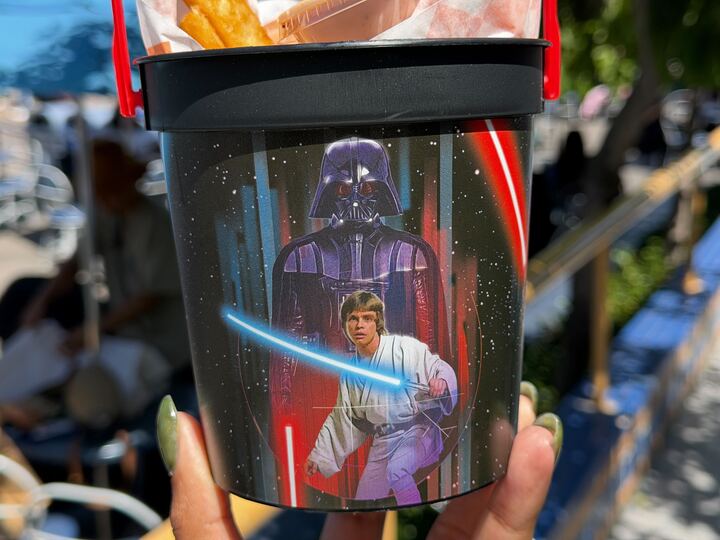 A closer look at the black Galactic Star Wars Souvenir bucket and its contrasting red handle.
