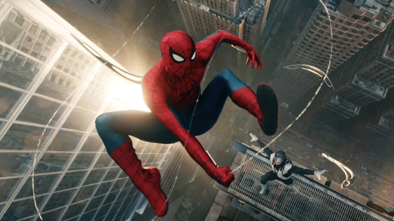 Tom Holland as Spider-Man swinging between skyscrapers from the air as an unknown enemy pursues in Spider-Man: Brand New Day
