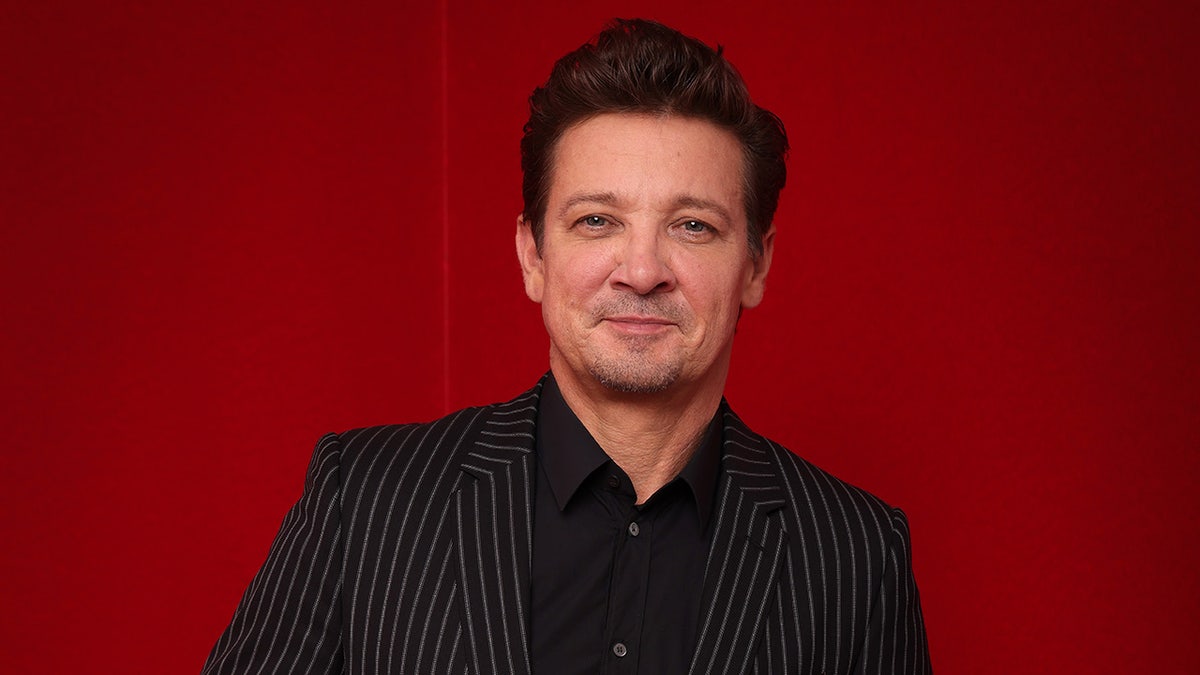 Jeremy Renner posing in a portrait studio at the Red Sea International Film Festival in Jeddah