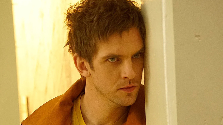 Dan Stevens as David Haller leans his head against the wall in Legion