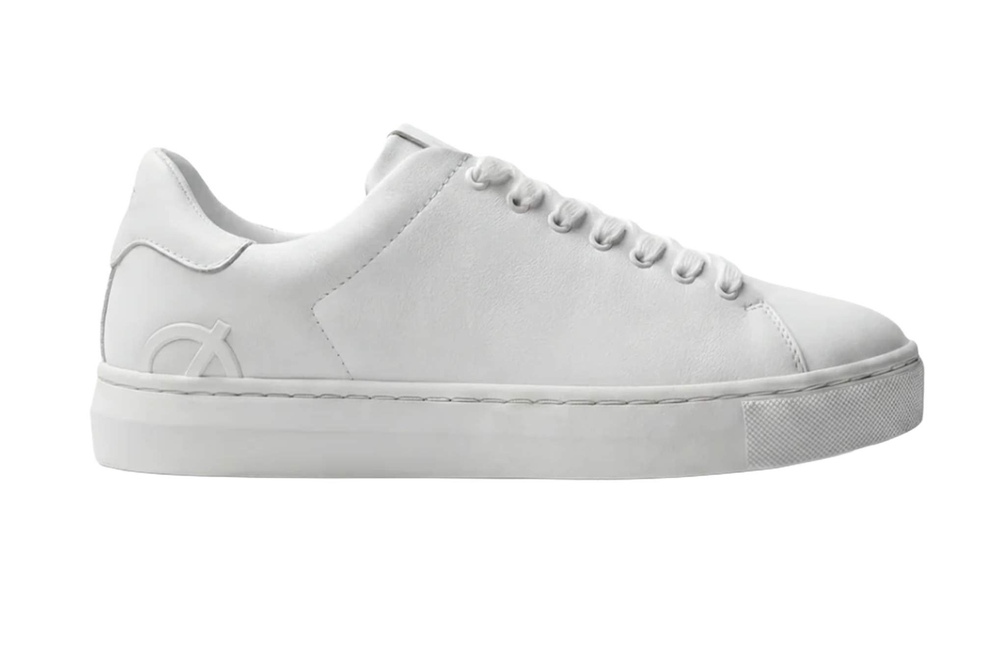 White sneaker with an embossed logo on the side.