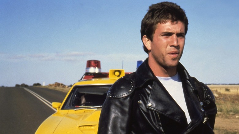 Mel Gibson as Max, surveying the scene in Mad Max