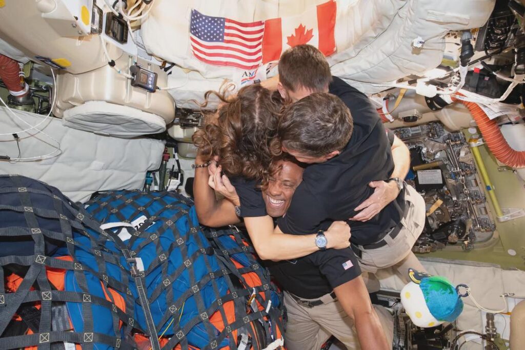On Flight Day 6 of the historic Artemis II mission (April 6, 2026), the four-member crew shared a poignant group hug that has quickly become the defining image of the journey.