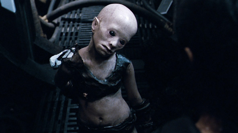 A mutated child with black who is a descendant of humans before it kills Manh in Pandorum