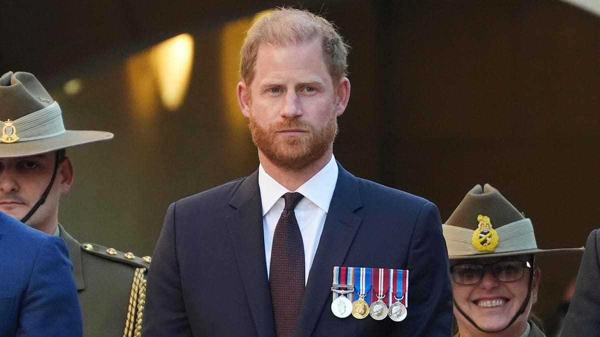 Prince Harry standing at the Australian War Memorial during the Last Post Ceremony