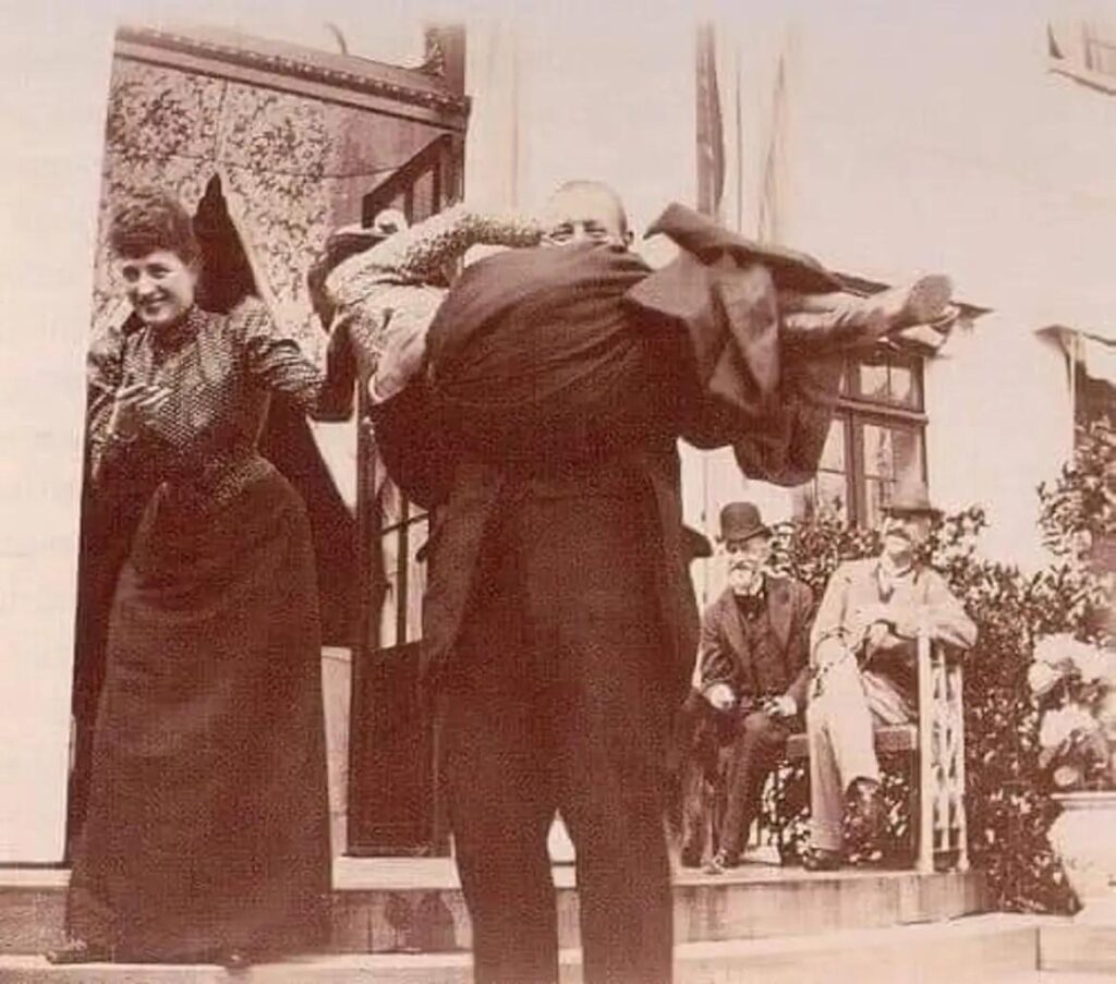 Prince George of Greece and Denmark Carrying His Aunt Empress Maria Feodorovna of Russia While His Other Aunt Queen Alexandra of the United Kingdom Laughs