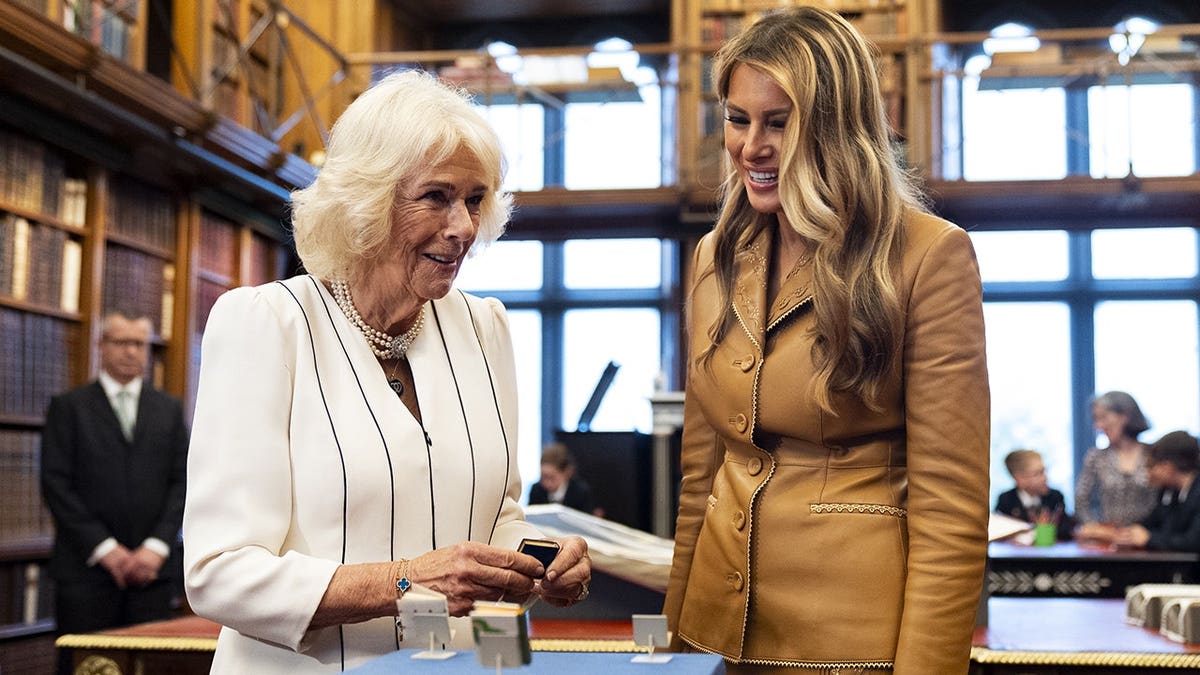 Queen Camilla and U.S. First Lady Melania Trump touring the Royal Library in Windsor, England