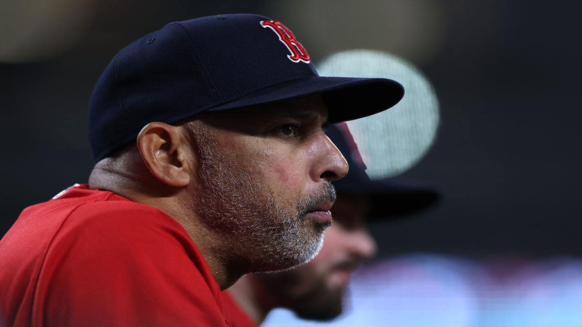 Manager Alex Cora of the Boston Red Sox looking on from the dugout at Oriole Park at Camden Yards