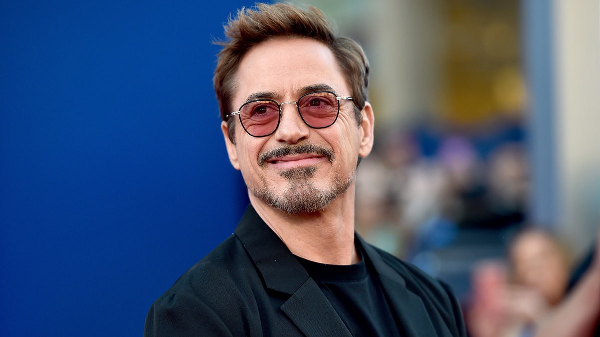 Robert Downey Jr. standing at the Spider-Man Homecoming premiere in Hollywood