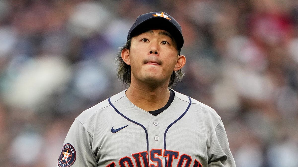 Houston Astros starting pitcher Tatsuya Imai walking back to the dugout during a baseball game in Seattle