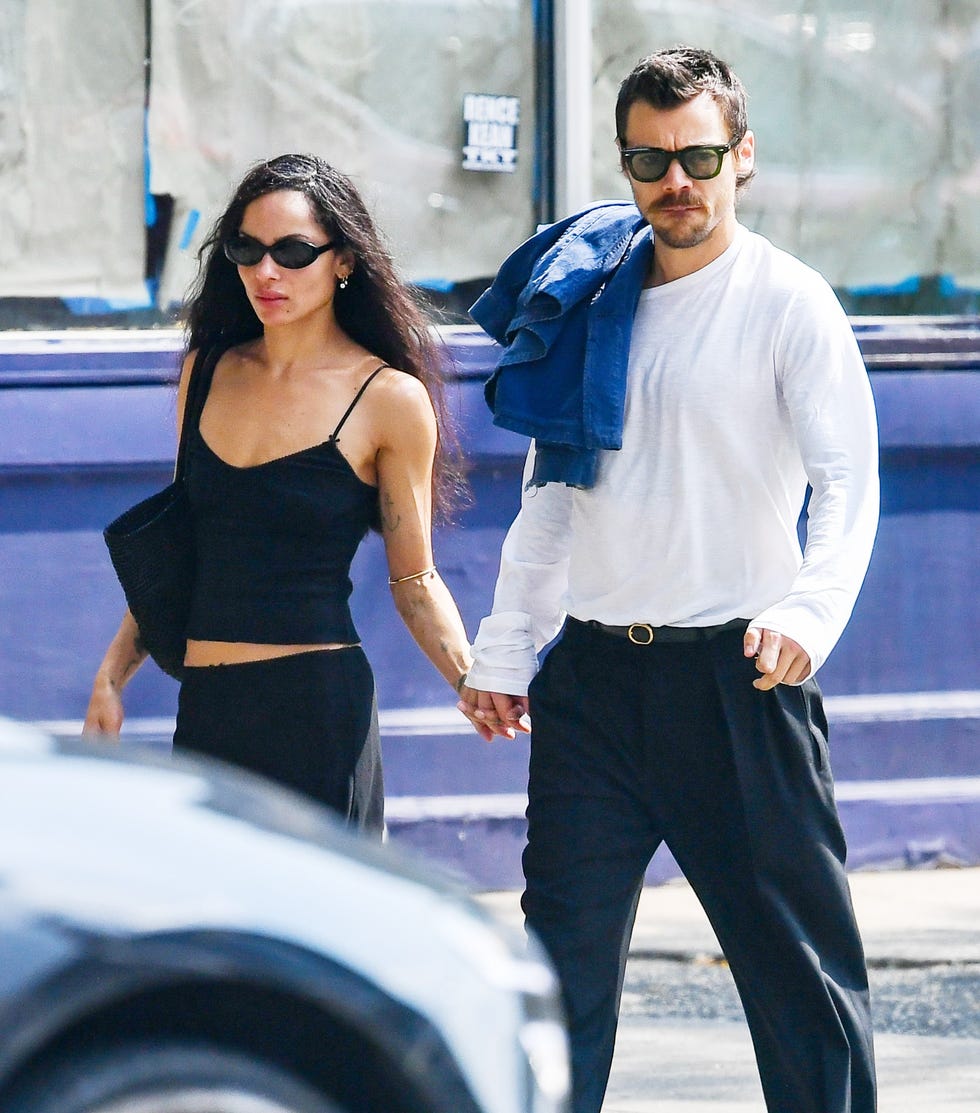 a couple walking together while holding hands