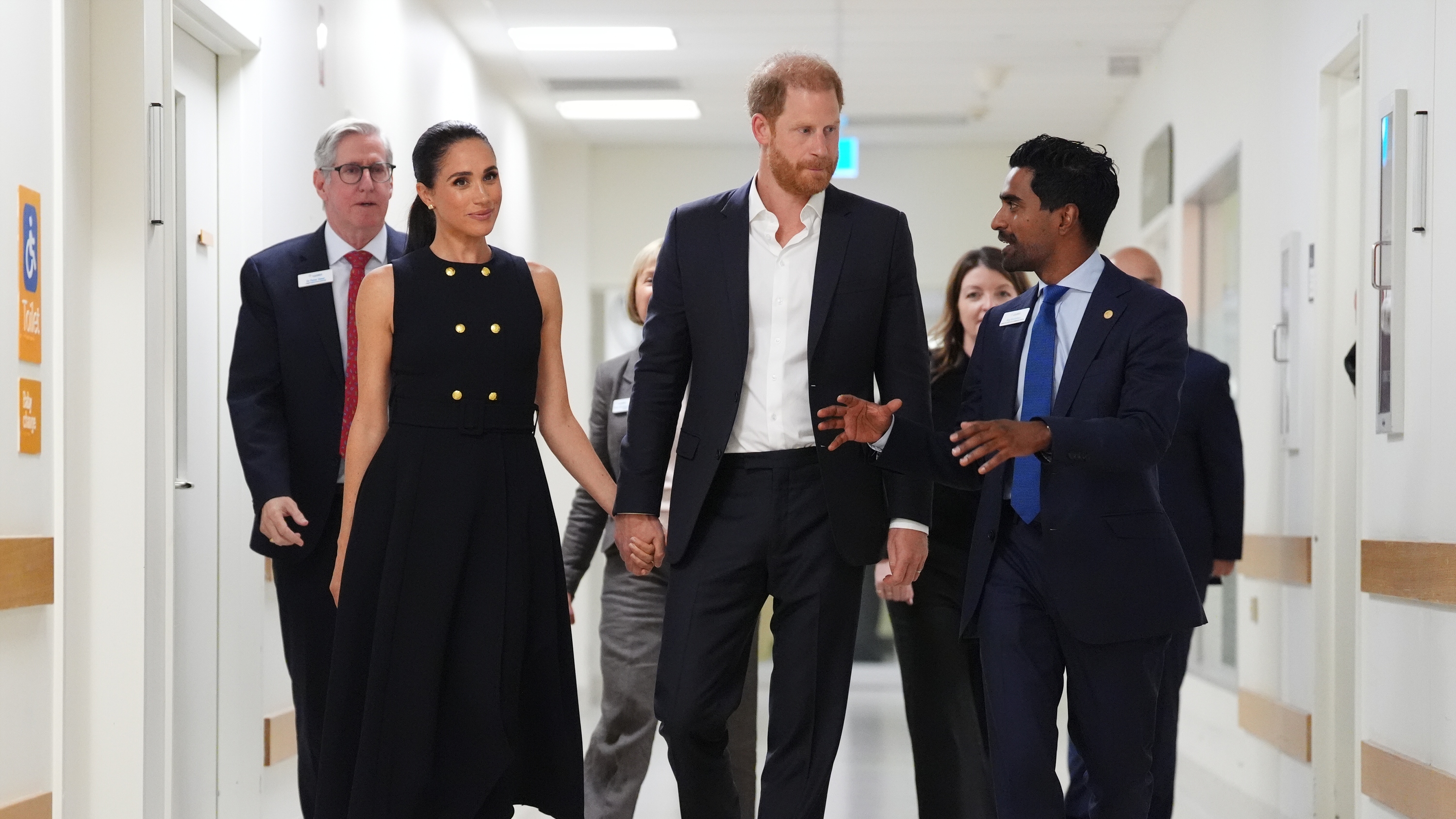 Meghan, Duchess of Sussex and Prince Harry talk with Kog Ravindran, chief of staff to the CEO &amp; executive director of communications at the Royal Children's Hospital, during a visit on April 14, 2026
