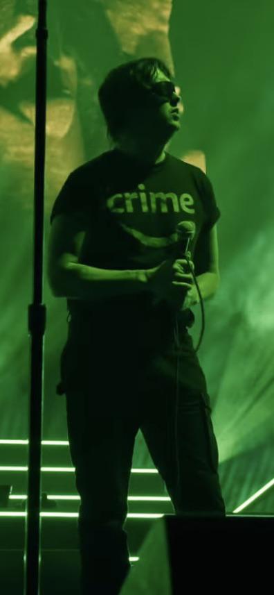 Julian Casablancas of the Strokes wearing an “Amazon Crime” shirt at Coachella